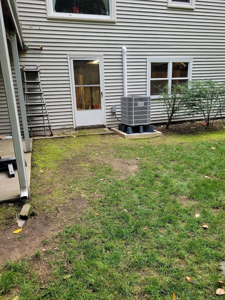 High-efficiency heat pump condenser installed at a Connecticut home for year-round heating