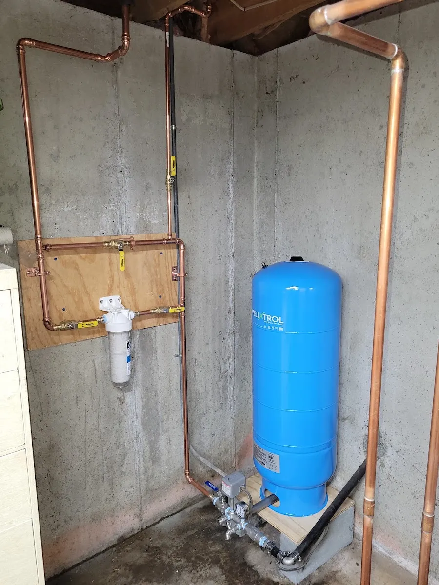 Well water pressure tank and copper piping serviced by Justin Nuño HVAC & Plumbing