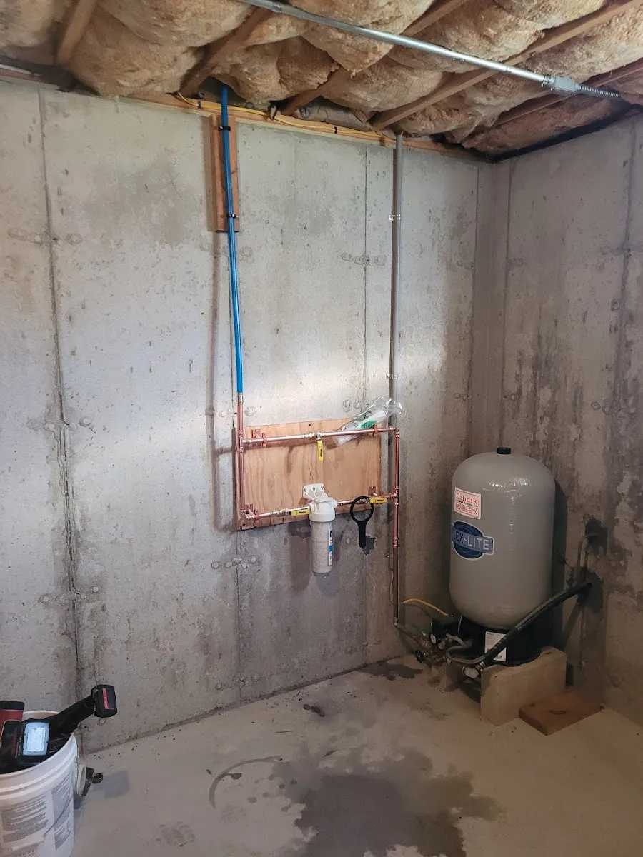 Whole-house water filtration and copper plumbing installed in a Connecticut basement